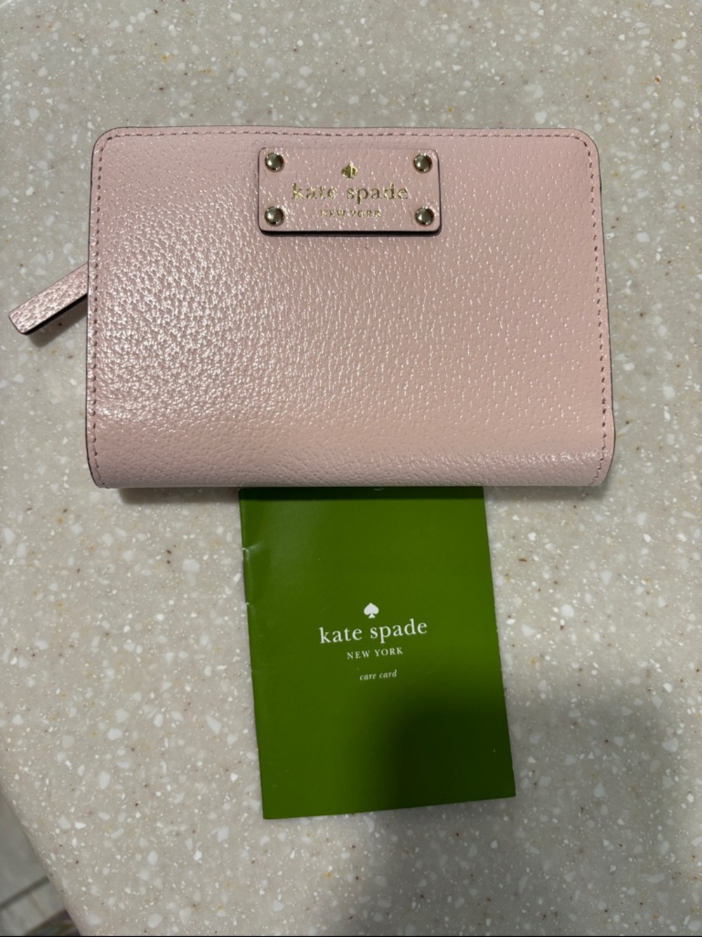 kate spade pale pink pebbled wallet with gold plaque